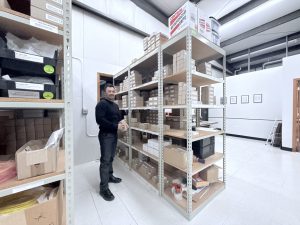 An employee at Migatron selecting a ultrasonic sensor